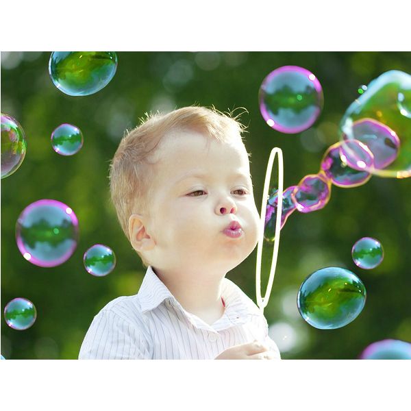 Bubble gun liquid refill bottle with a clear label showing liquid inside