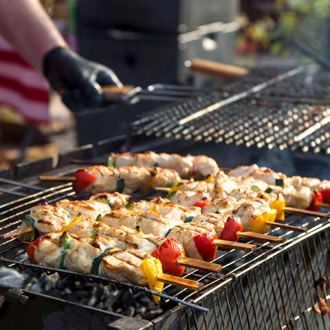 Square barbecue grill featuring a wooden handle and stainless steel.