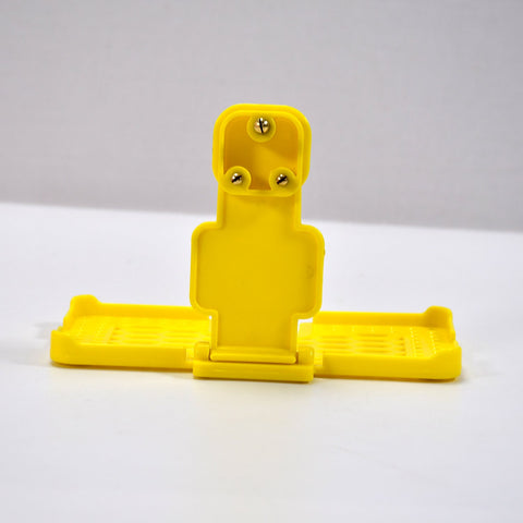 Yellow mobile holder for wall socket.