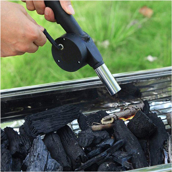 Hand crank fan for easy charcoal grill ignition.