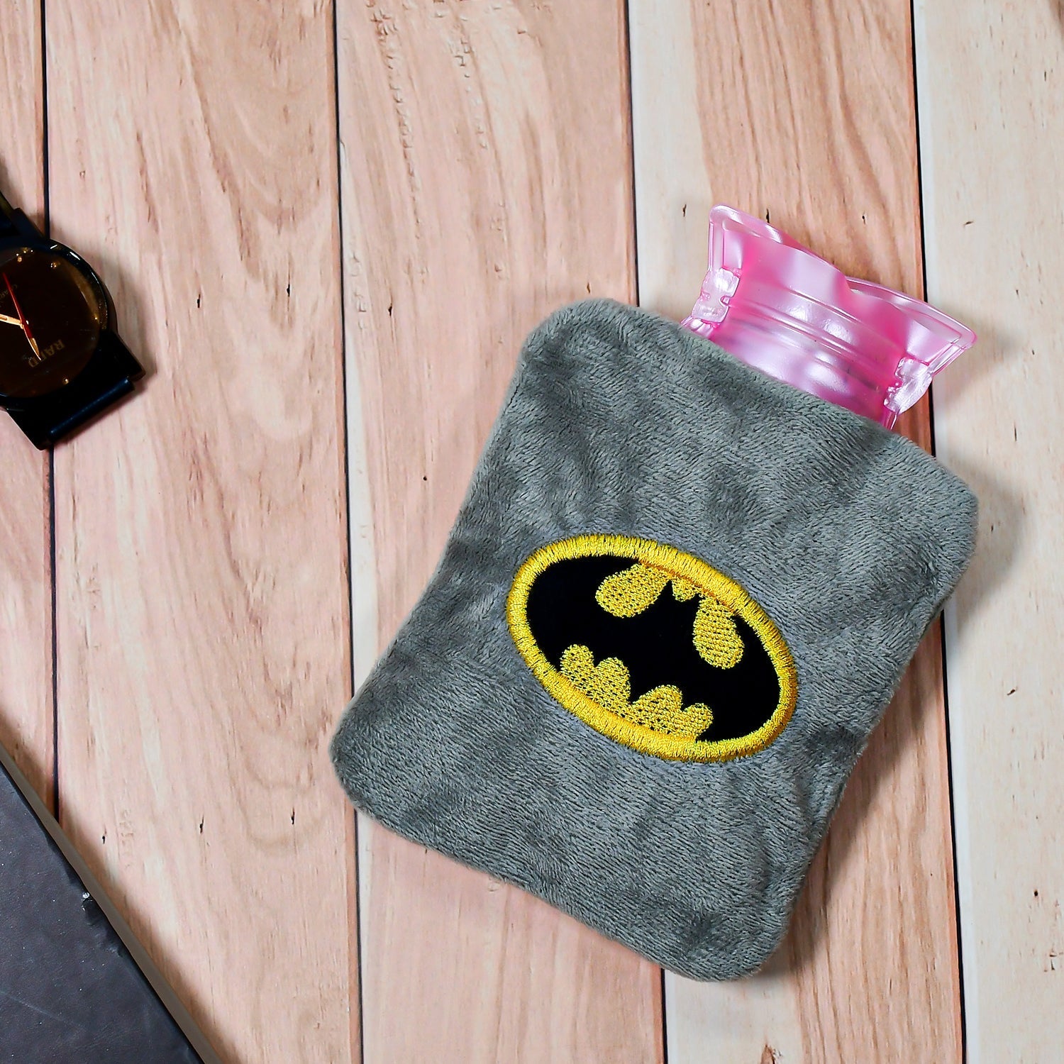 Batman-themed hot water bag for pain relief and warmth